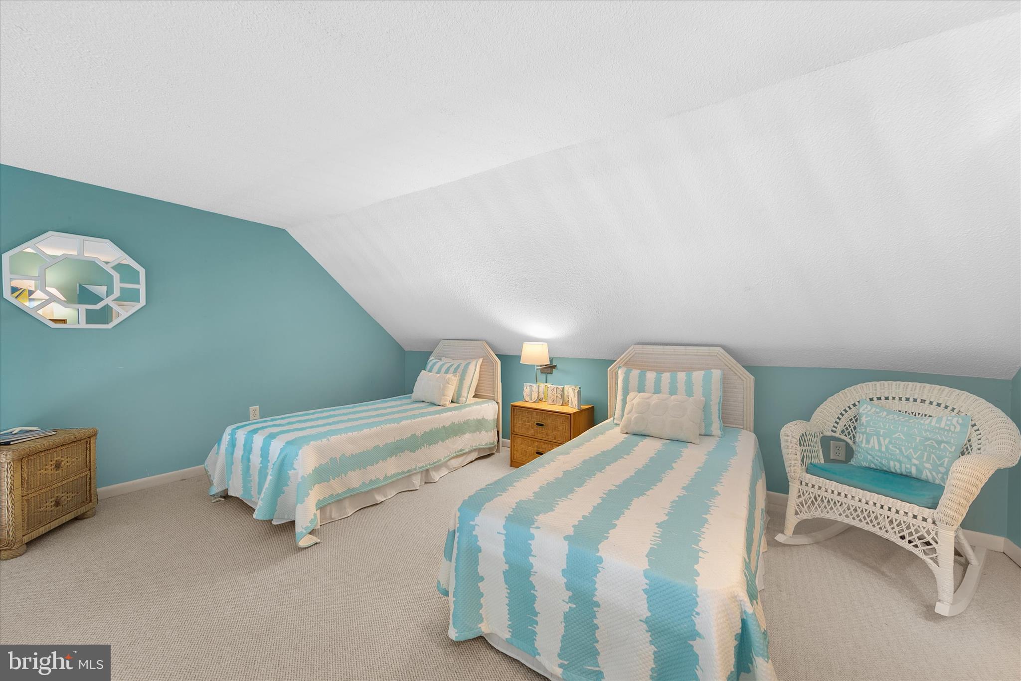 39362 Racquet Lane, Unit 8605 Bethany Beach, DE 19930 - Photo 22 of 53 a bedroom with two beds and a chair
