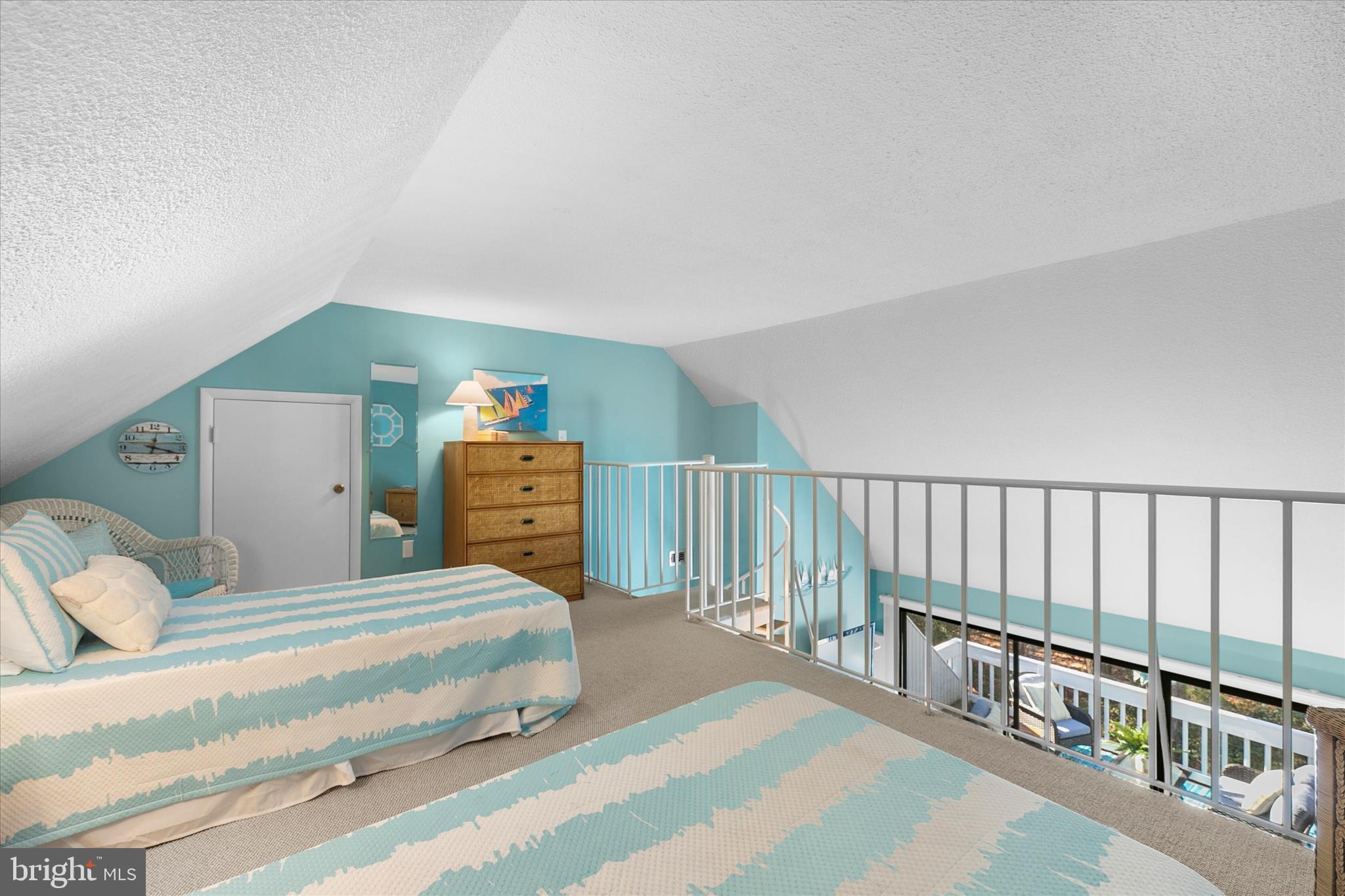39362 Racquet Lane, Unit 8605 Bethany Beach, DE 19930 - Photo 23 of 53 a bedroom with a bed and dresser