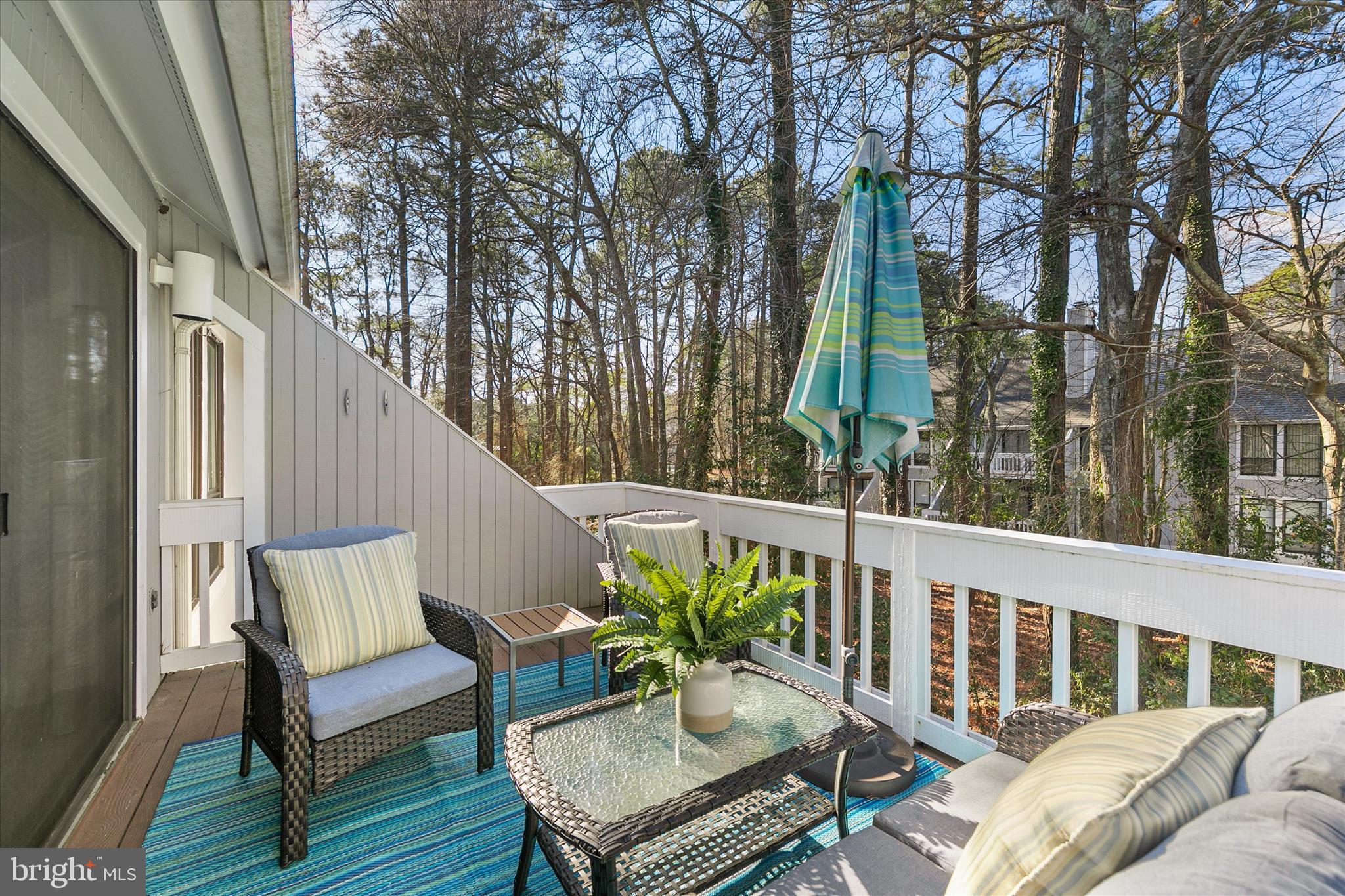39362 Racquet Lane, Unit 8605 Bethany Beach, DE 19930 - Photo 28 of 53 a view of a two chairs in the balcony