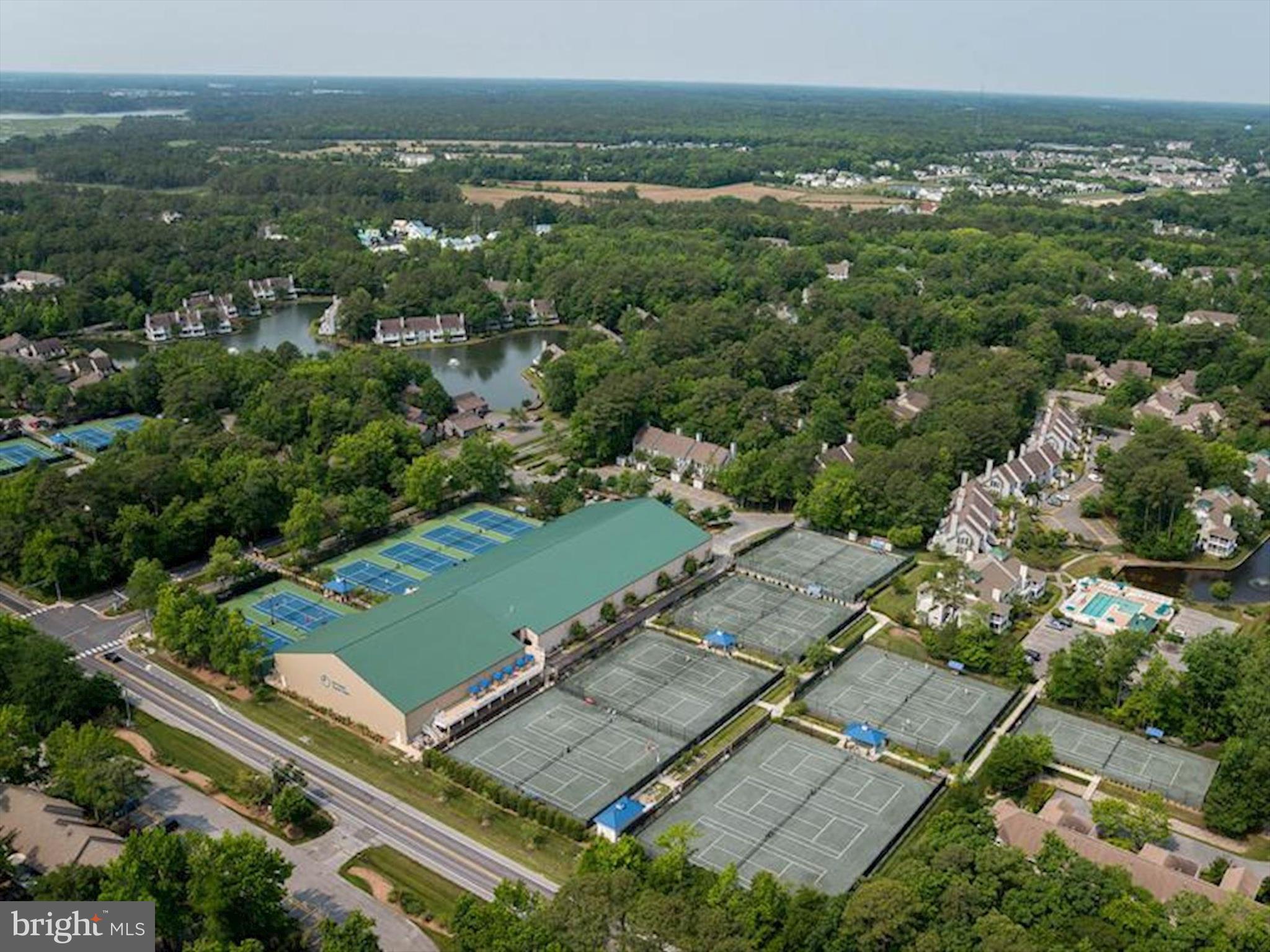 39362 Racquet Lane, Unit 8605 Bethany Beach, DE 19930 - Photo 44 of 53 an aerial view of residential houses with outdoor space