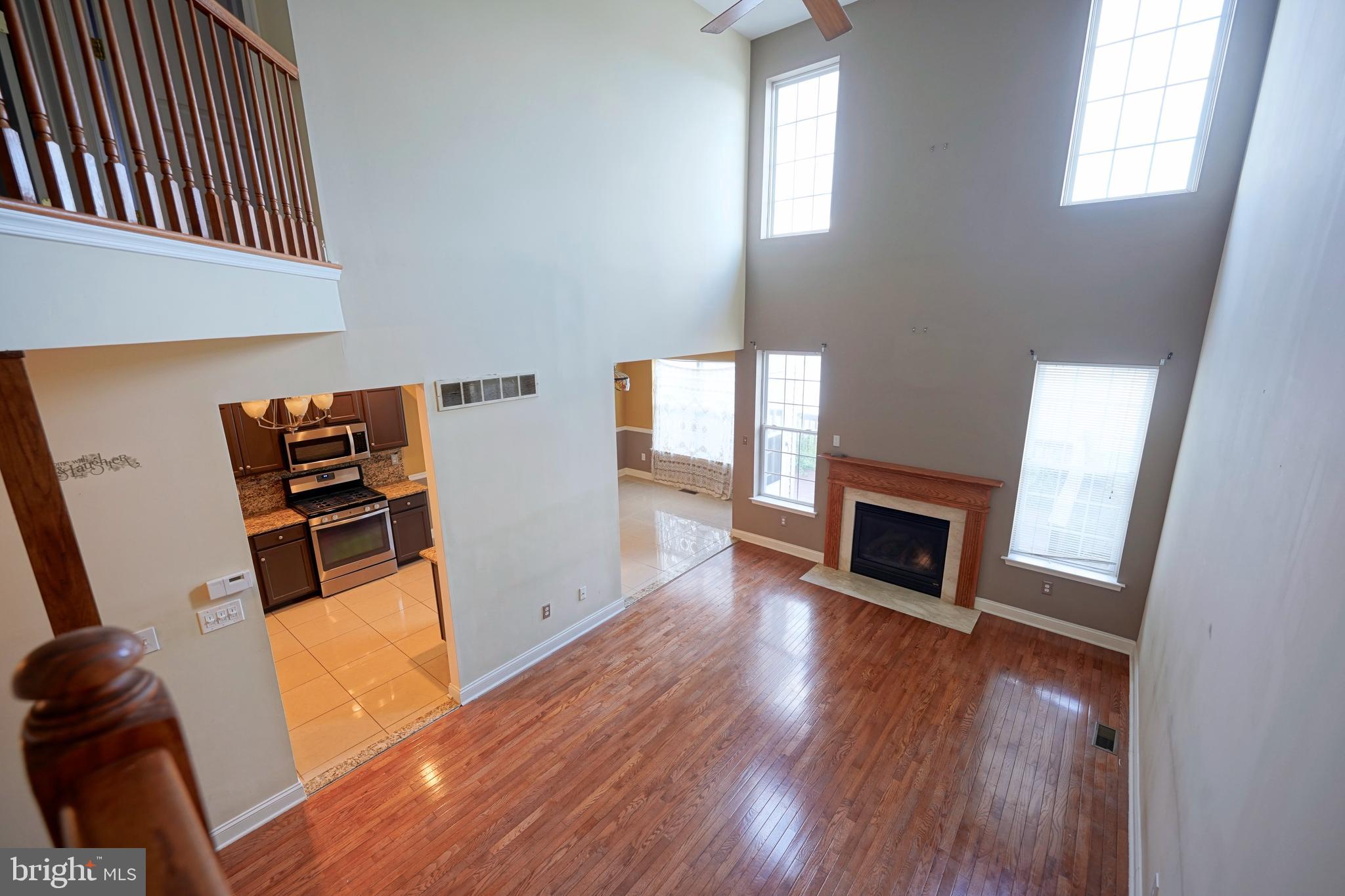 8 Bryce Road Berlin, NJ 08009 - Photo 19 of 36 a view of a livingroom with wooden floor and a fireplace