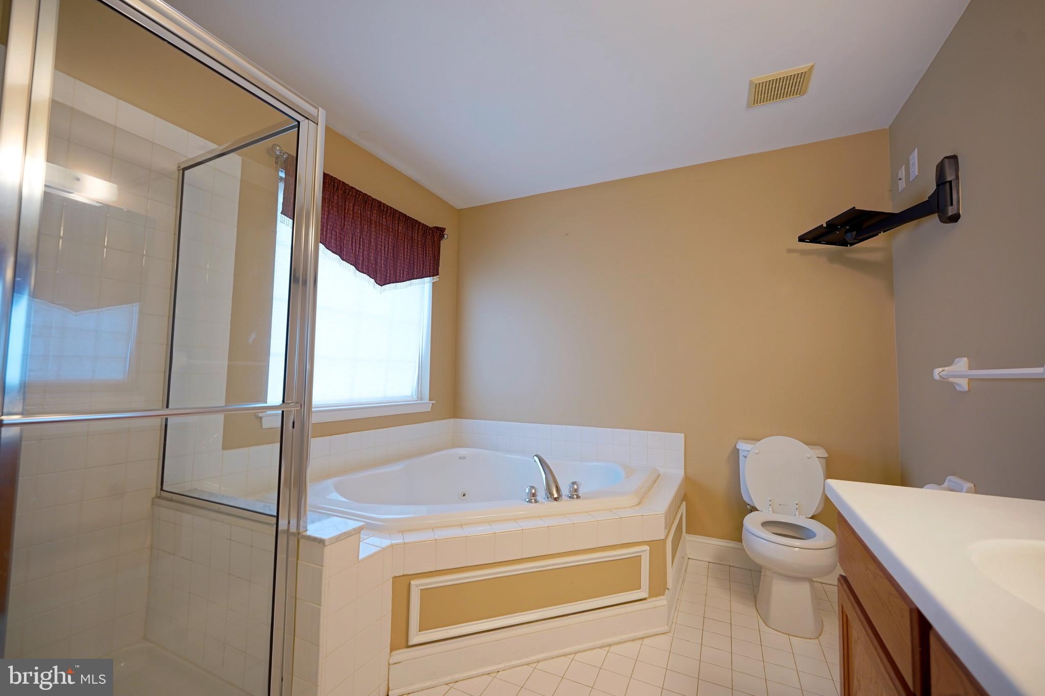 8 Bryce Road Berlin, NJ 08009 - Photo 22 of 36 a bathroom with a bathtub and a toilet