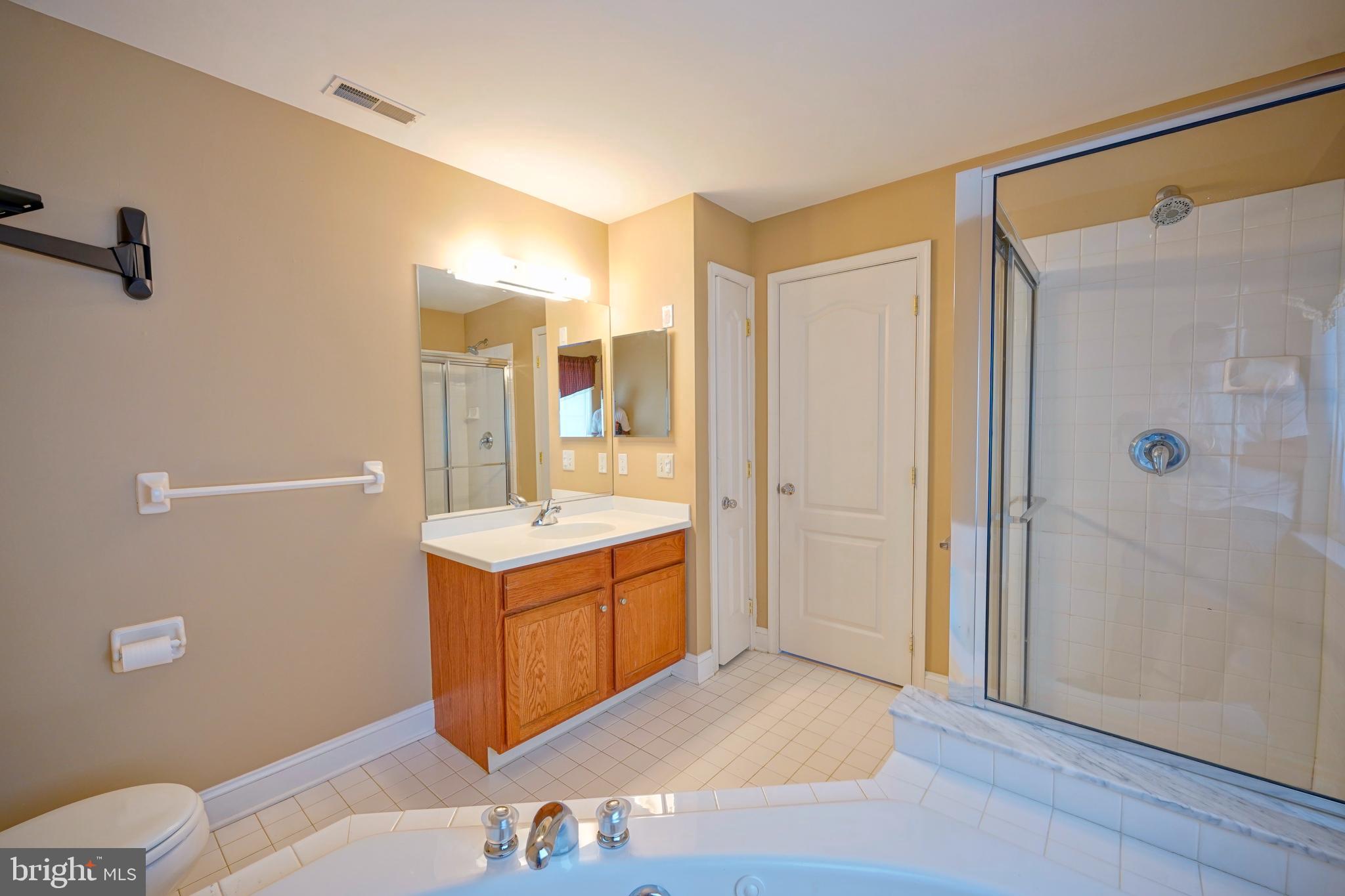 8 Bryce Road Berlin, NJ 08009 - Photo 24 of 36 a bathroom with a sink mirror vanity and toilet