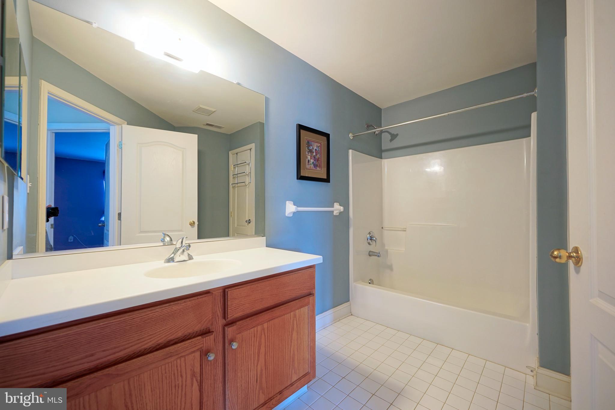 8 Bryce Road Berlin, NJ 08009 - Photo 27 of 36 a bathroom with a double vanity sink mirror and shower