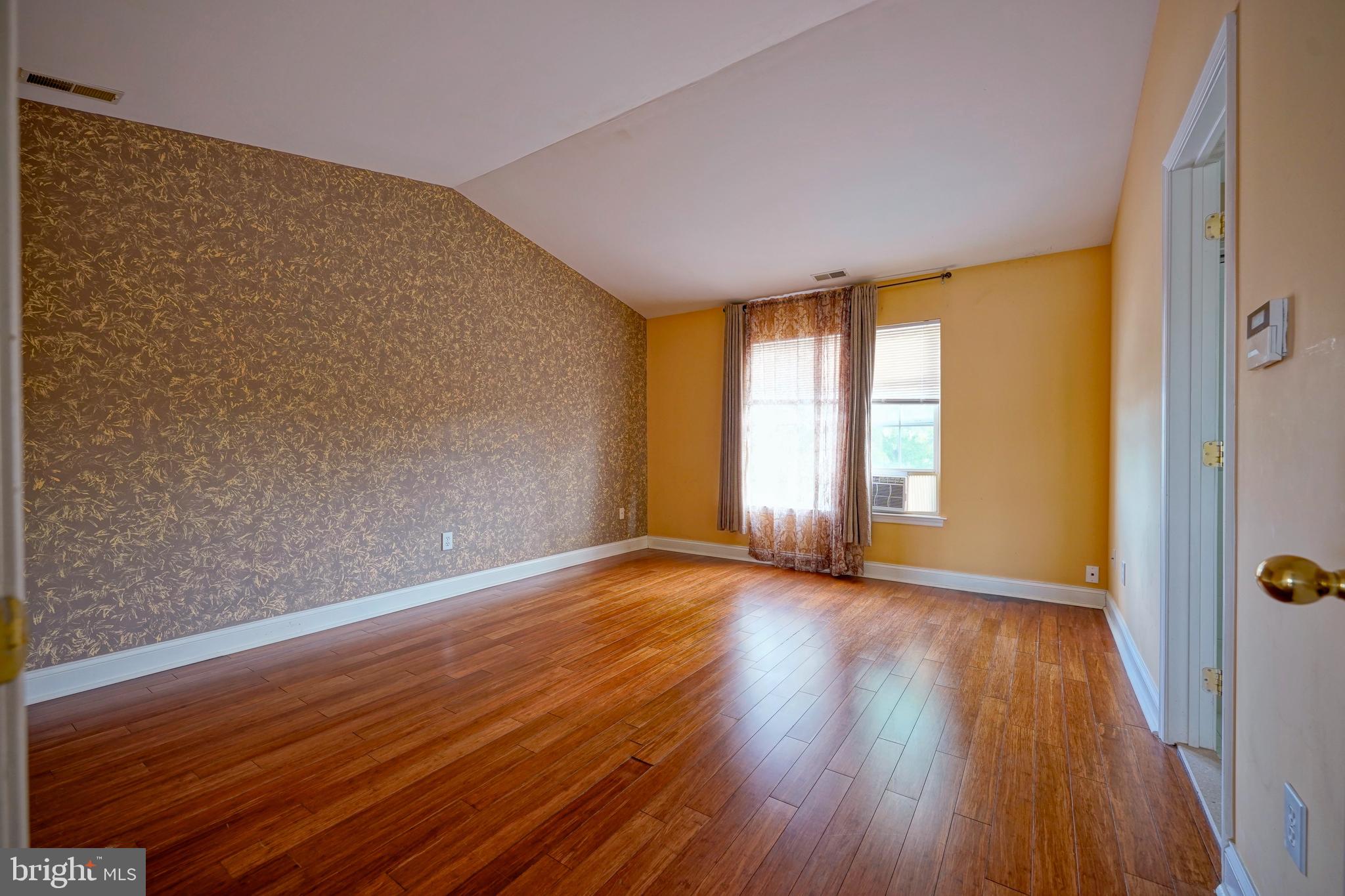 8 Bryce Road Berlin, NJ 08009 - Photo 28 of 36 a view of an empty room with wooden floor and a window