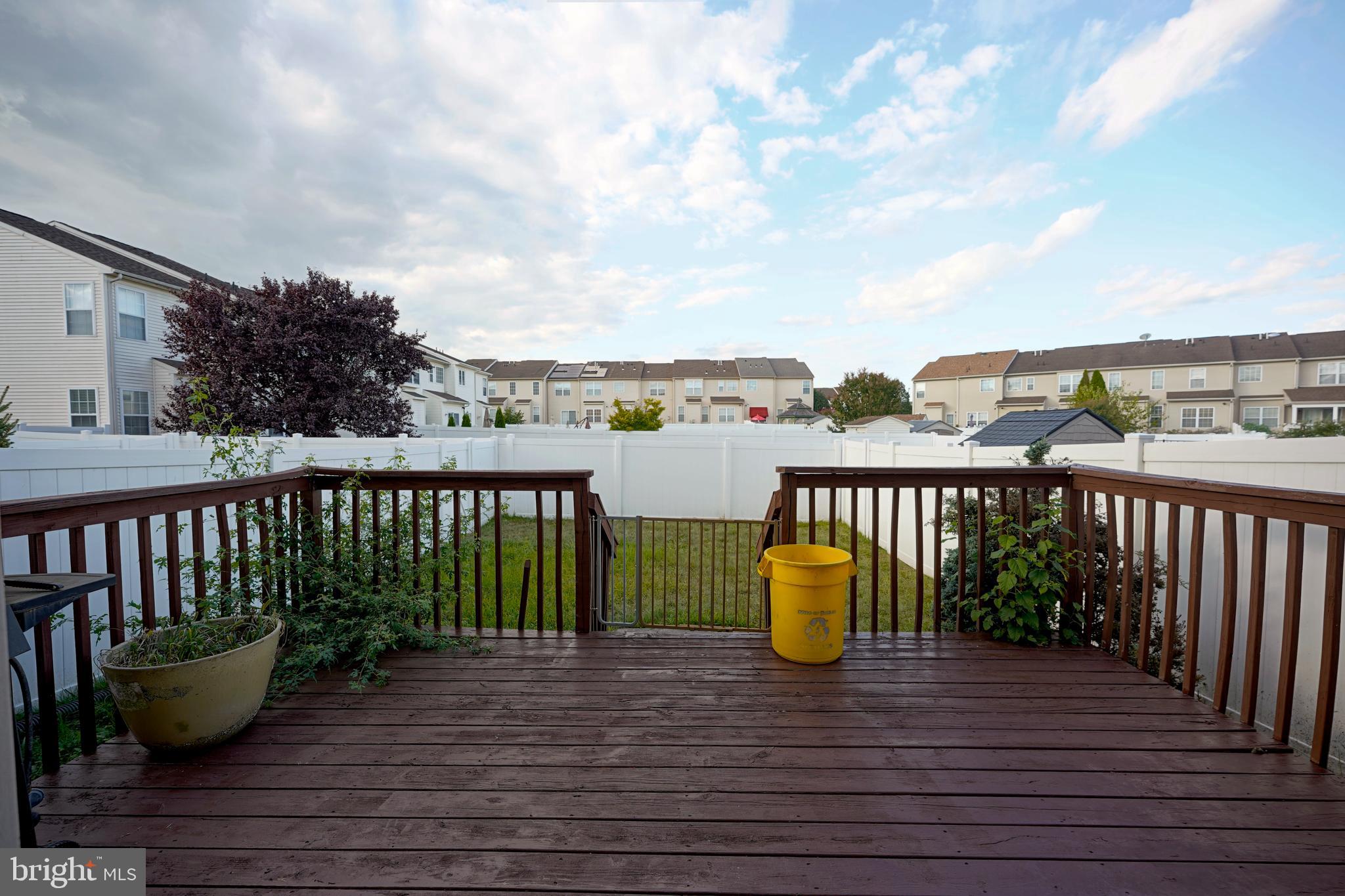 8 Bryce Road Berlin, NJ 08009 - Photo 8 of 36 a view of a balcony with two chairs and a potted plant