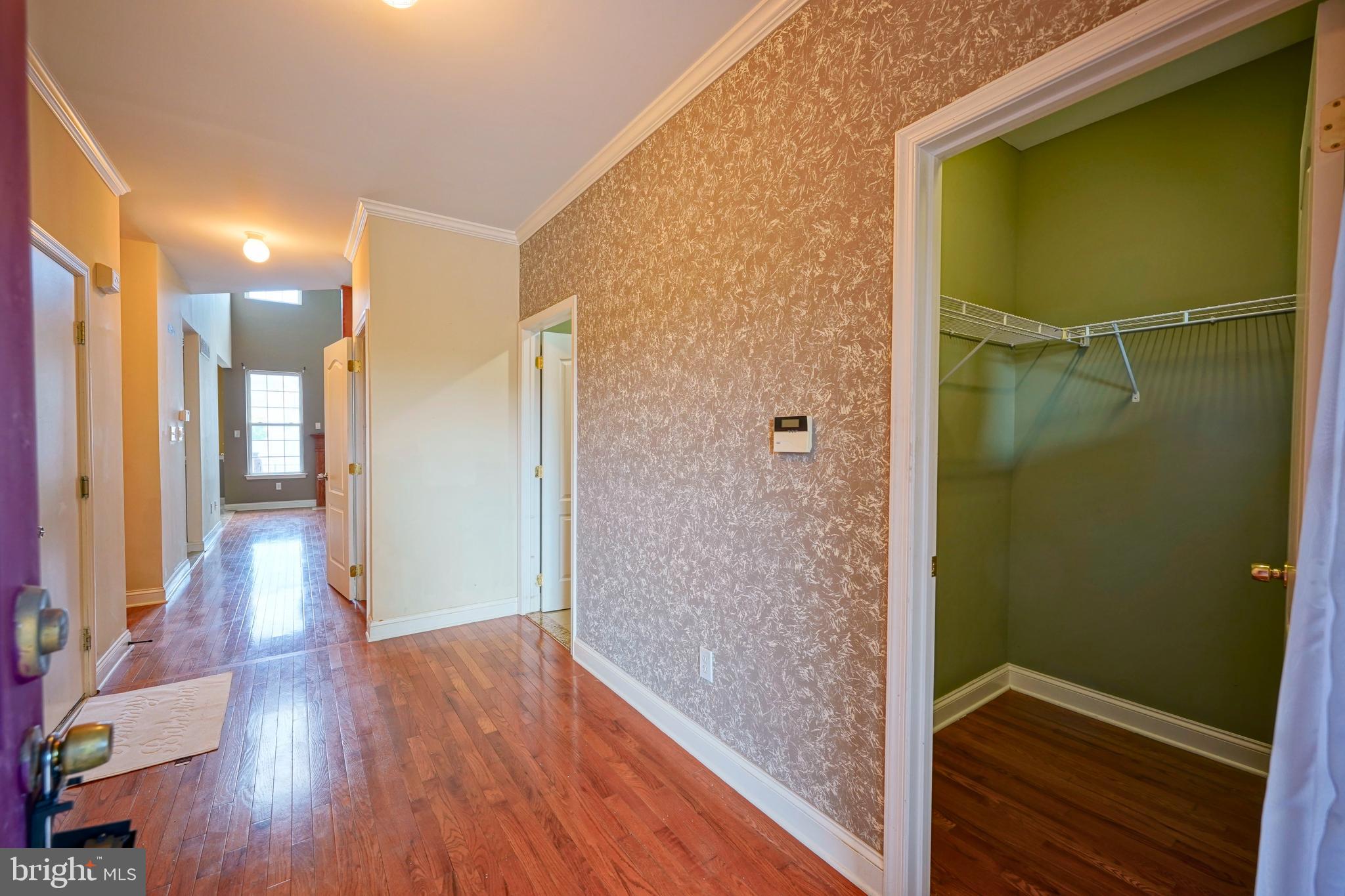 8 Bryce Road Berlin, NJ 08009 - Photo 9 of 36 a view of hallway with livingroom and wooden floor