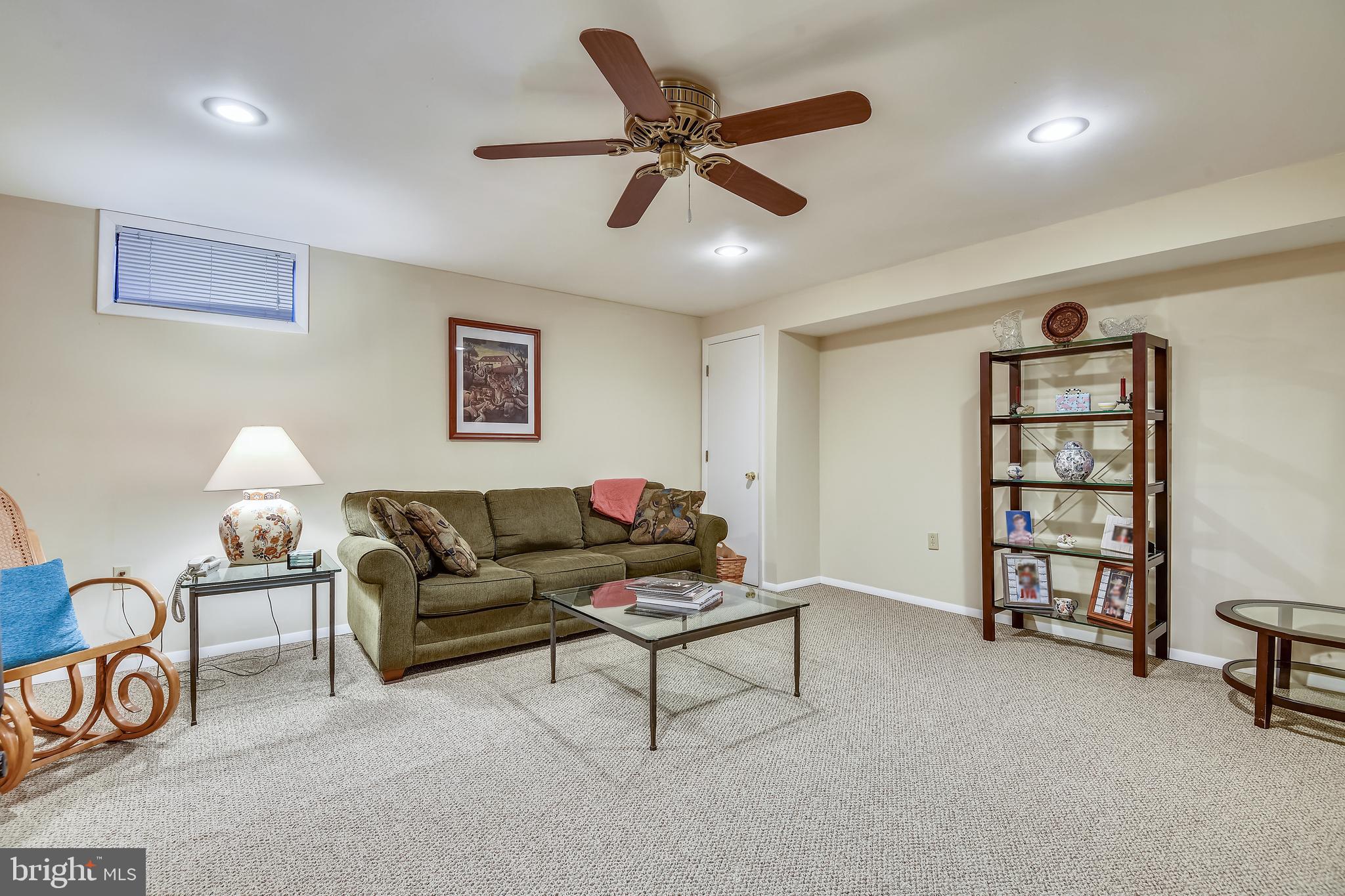7016 Sherwood Road, Unit 32 Baltimore, MD 21239 - Photo 26 of 41 Family Room with Carpet & Ceiling Fan