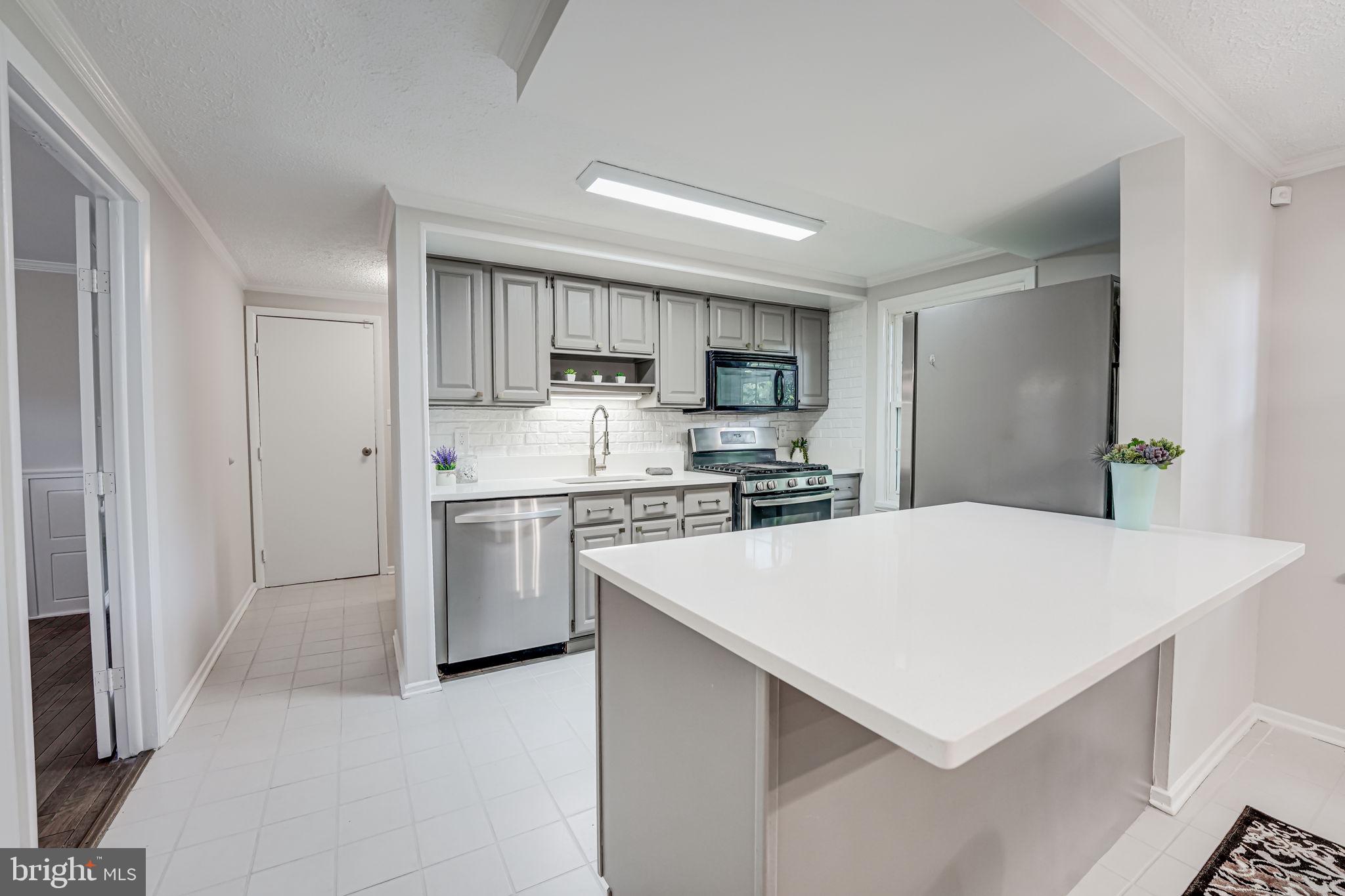 12250 Angel Wing Court Reston, VA 20191 - Photo 11 of 69 Kitchen features new sink, faucet, quartz counters