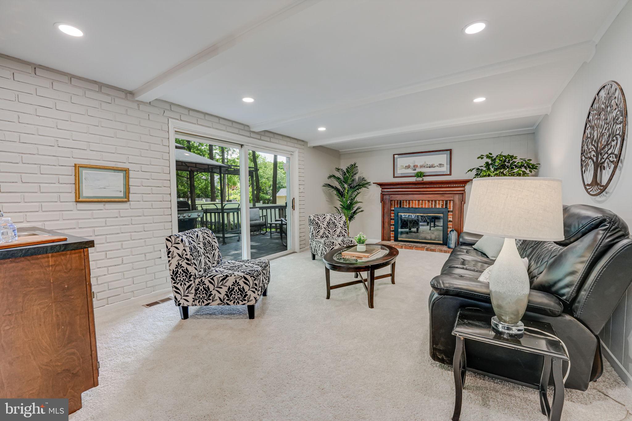 12250 Angel Wing Court Reston, VA 20191 - Photo 17 of 69 Family room features beamed ceilings + deck access