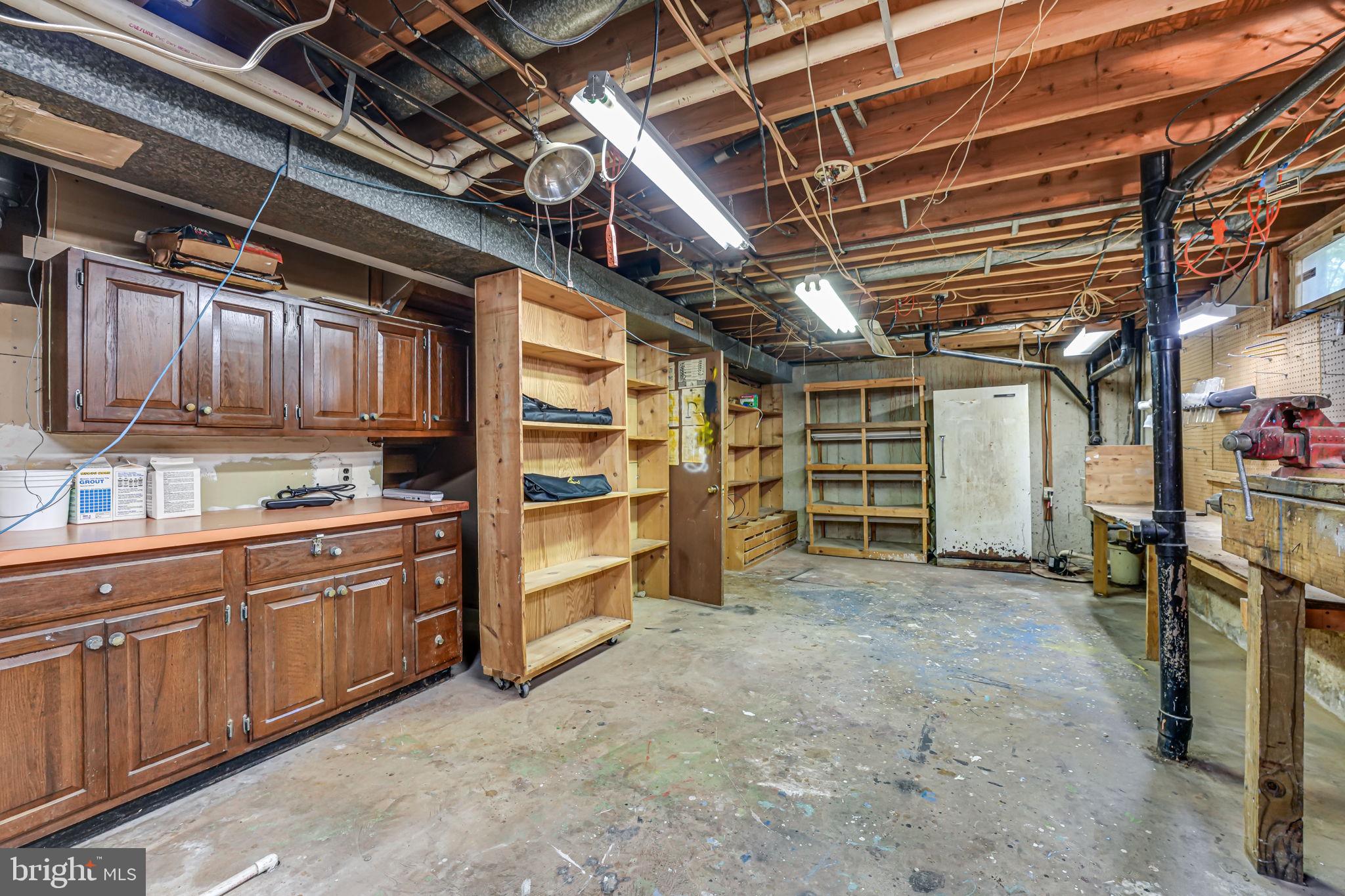12250 Angel Wing Court Reston, VA 20191 - Photo 55 of 69 Even more cabinets and workshop shelves