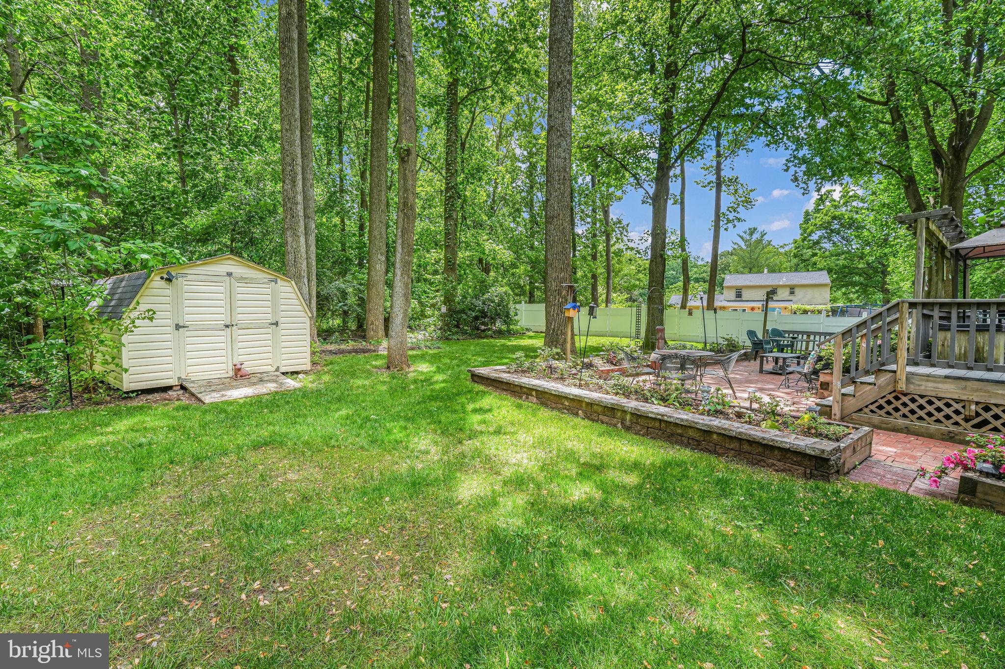 12250 Angel Wing Court Reston, VA 20191 - Photo 59 of 69 View of patio and wooded area behind house