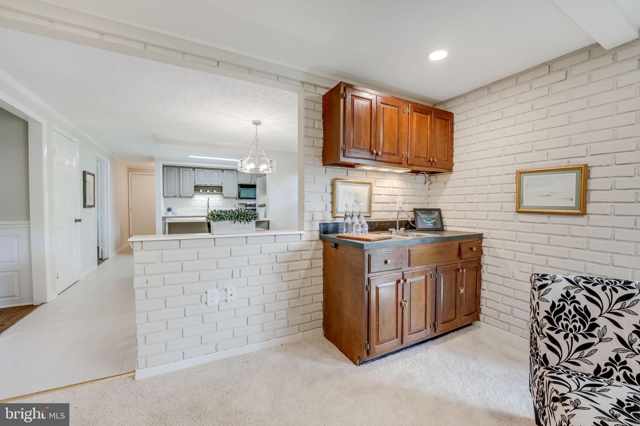 12250 Angel Wing Court Reston, VA 20191 - Photo 9 of 69 Built in wet bar featured in the family room