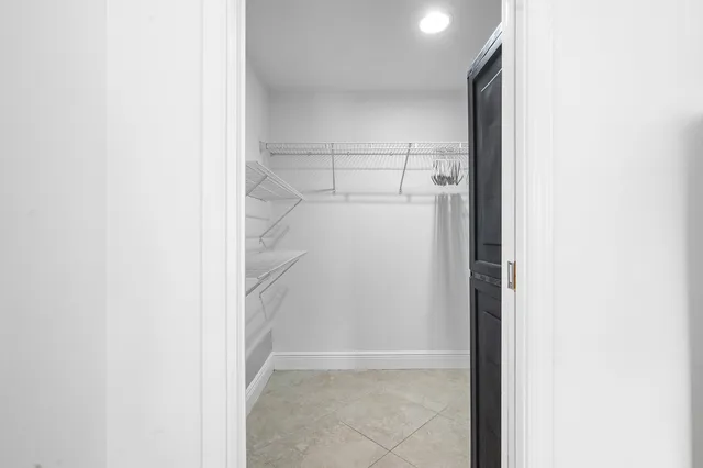 a view of closet area with empty racks