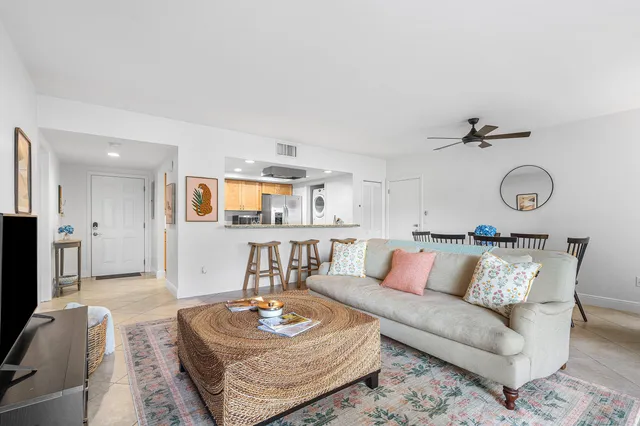 a living room with furniture and a table