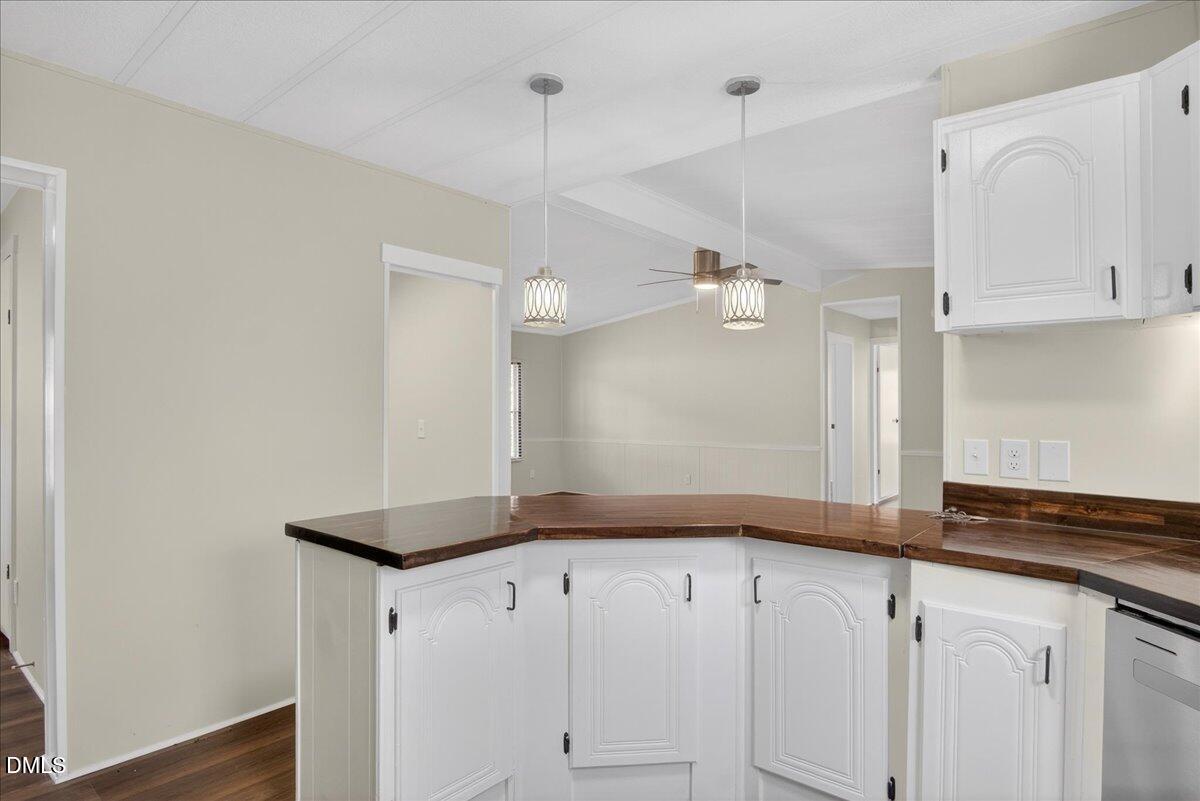 2428 Sims Bridge Road Kittrell, NC 27544 - Photo 13 of 57 a view of a kitchen with cabinets and wooden floor