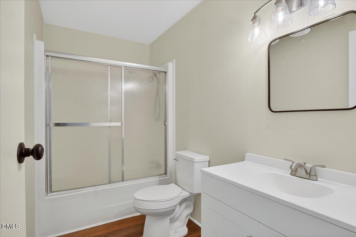 2428 Sims Bridge Road Kittrell, NC 27544 - Photo 30 of 57 a bathroom with a sink a toilet and shower