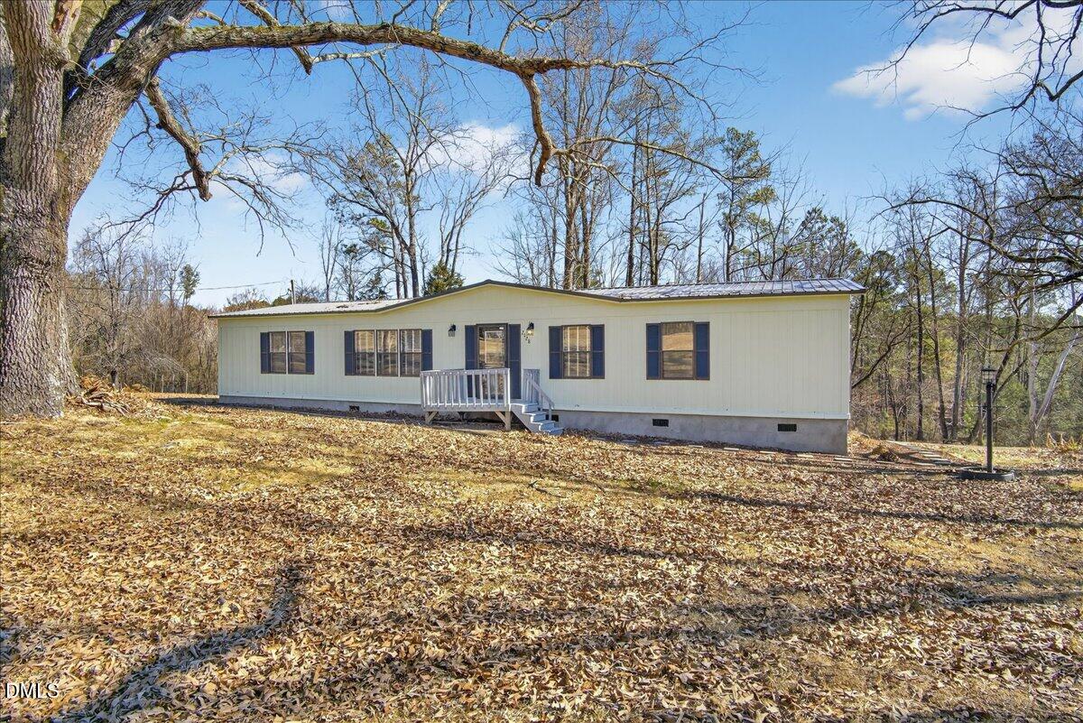 2428 Sims Bridge Road Kittrell, NC 27544 - Photo 44 of 57 a view of a house with a yard