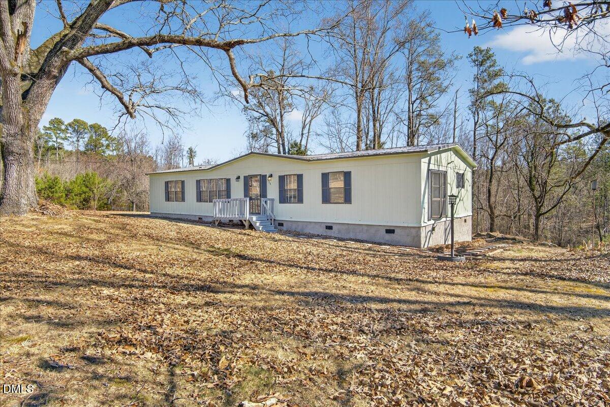 2428 Sims Bridge Road Kittrell, NC 27544 - Photo 46 of 57 a house view with a outdoor space