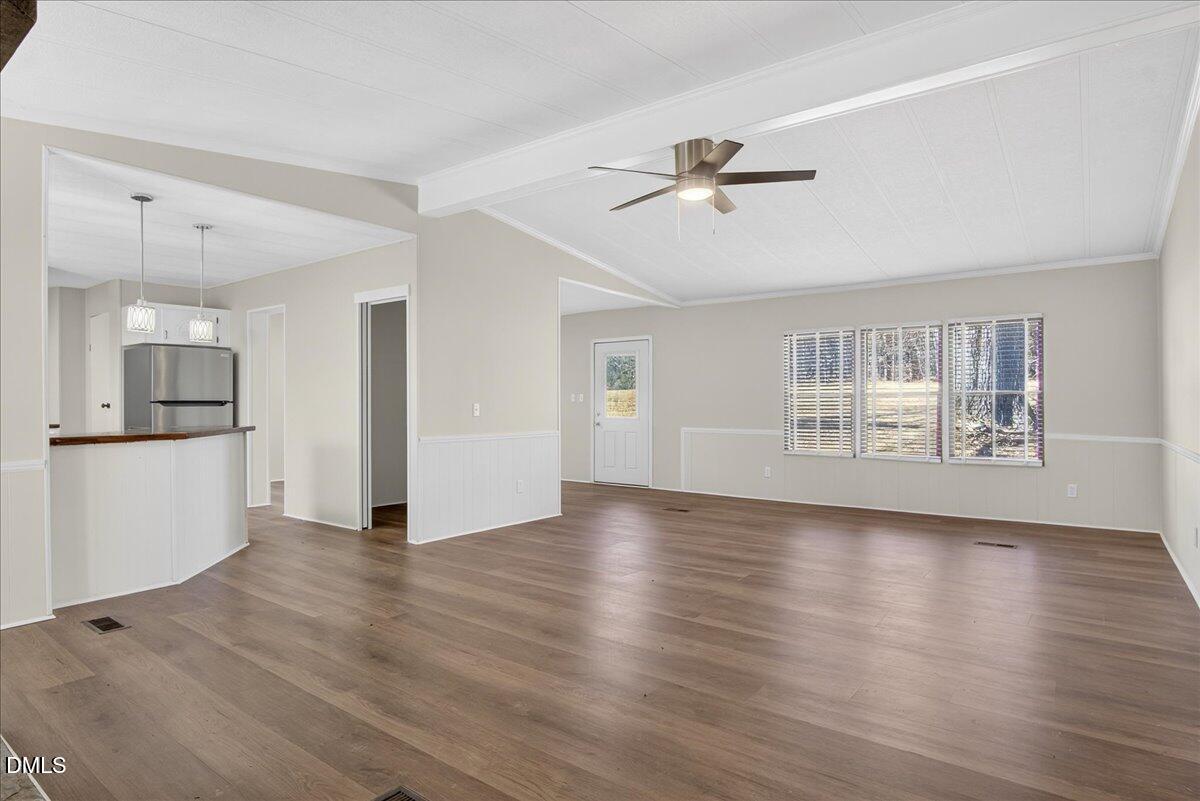 2428 Sims Bridge Road Kittrell, NC 27544 - Photo 7 of 57 a view of an empty room with a kitchen