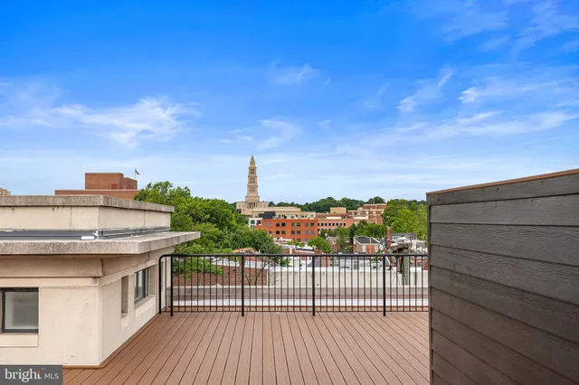 a view of a balcony with two chairs and a table