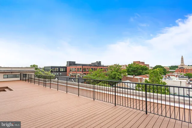 a view of a balcony with wooden floor