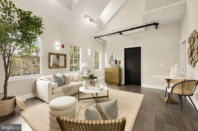 a living room with furniture and a table