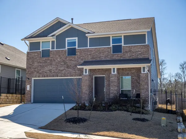 a front view of a house with yard