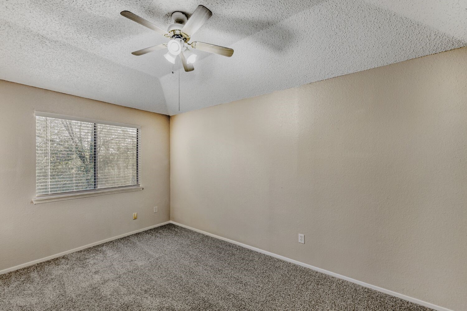 9727 Orangevale Drive Spring, TX 77379 - Photo 15 of 26 an empty room with a window and a fan