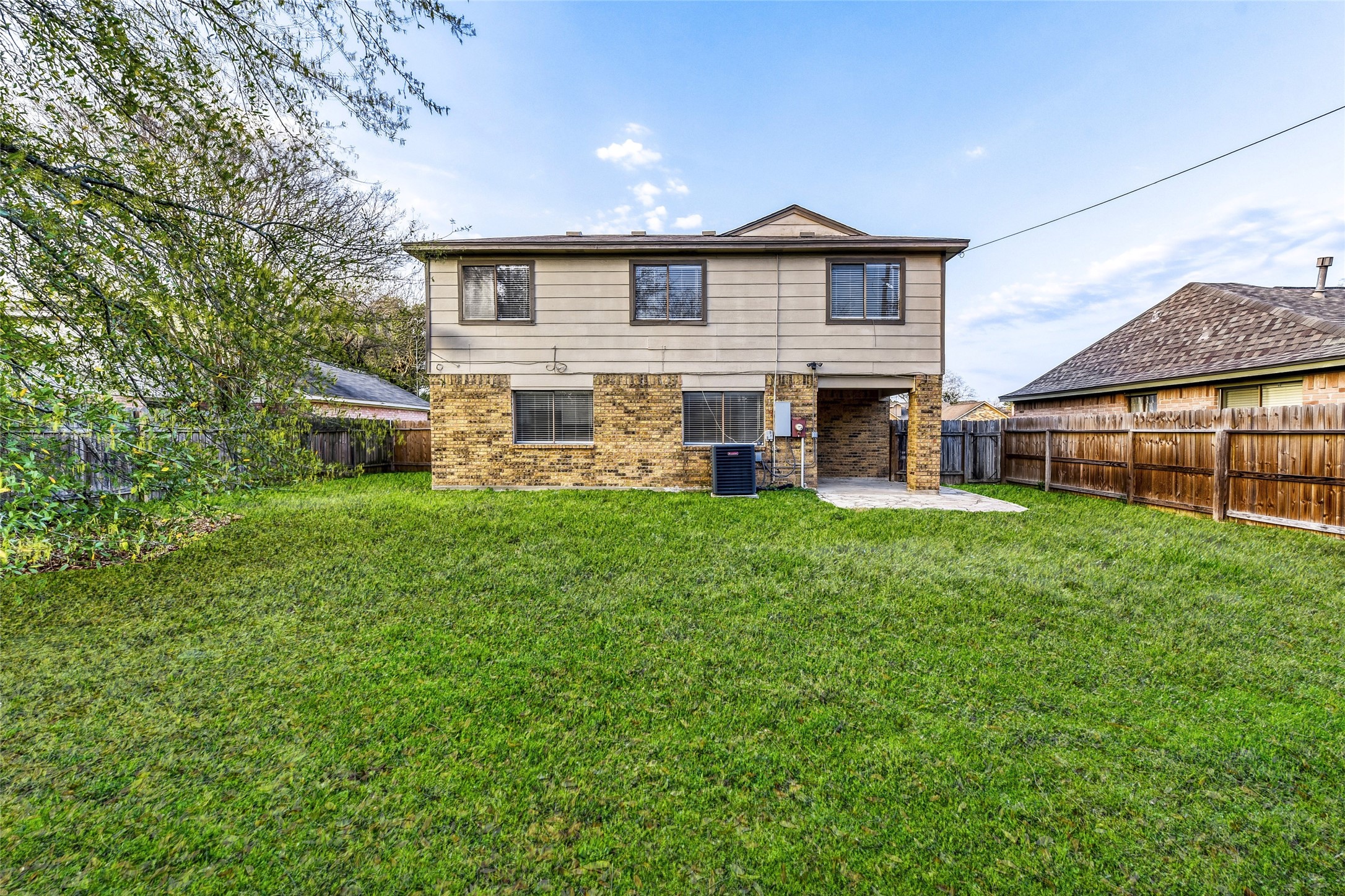 9727 Orangevale Drive Spring, TX 77379 - Photo 23 of 26 a front view of house with yard and green space