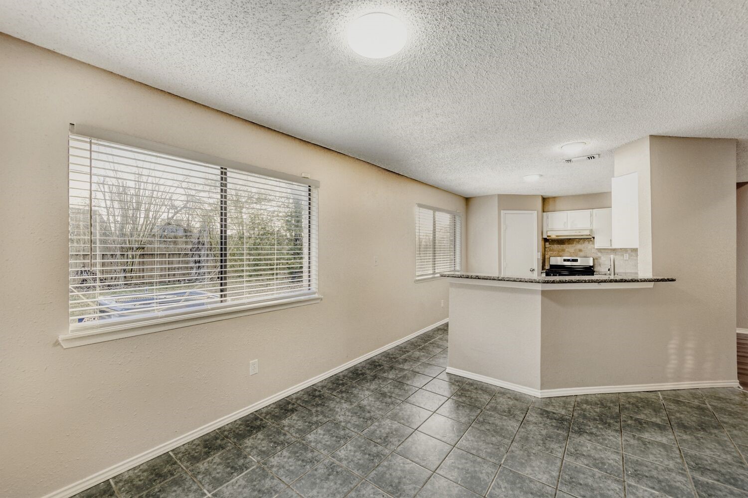 9727 Orangevale Drive Spring, TX 77379 - Photo 8 of 26 a view of kitchen with stainless steel appliances granite countertop a stove a sink and a refrigerator