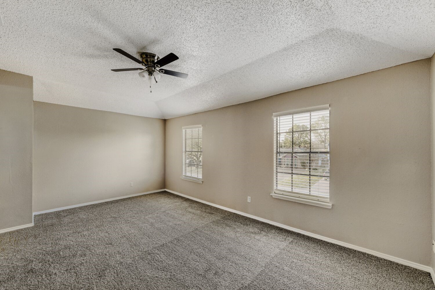 9727 Orangevale Drive Spring, TX 77379 - Photo 10 of 26 an empty room with windows and fan