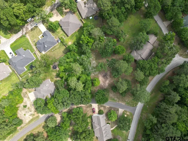 an aerial view of house with yard