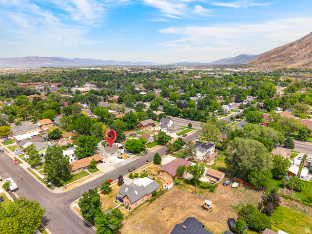 74 South 300 East Springville, UT 84663 - Photo 44 of 48 Aerial perspective showcasing a residential neighborhood with a prominent mountain backdrop