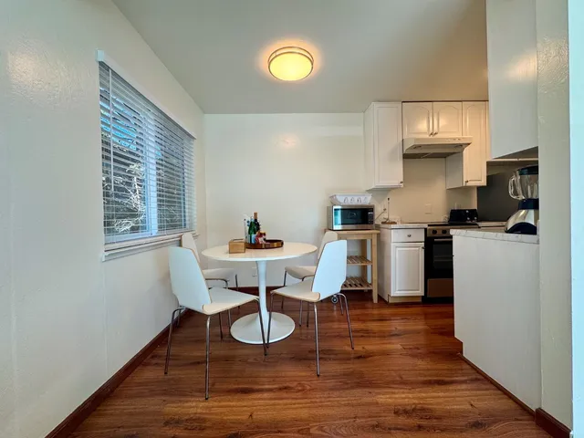 a work room with furniture and wooden floor