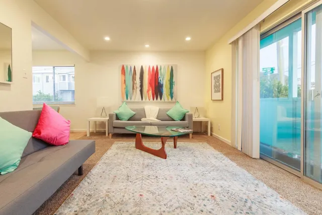 a view of a room that has a window and chair