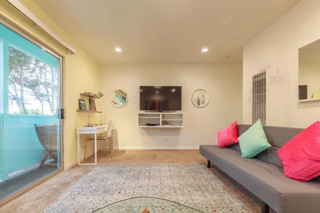 a bed room with a bed and a window