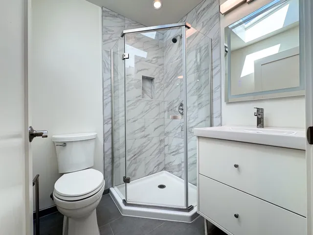a view of kitchen with granite countertop cabinets and a sink