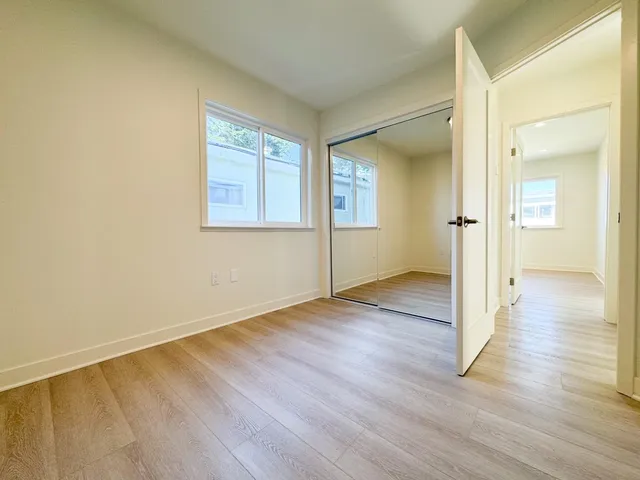 a kitchen with white cabinets and a sink