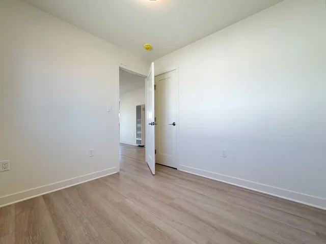 a kitchen with a stove cabinets and refrigerator
