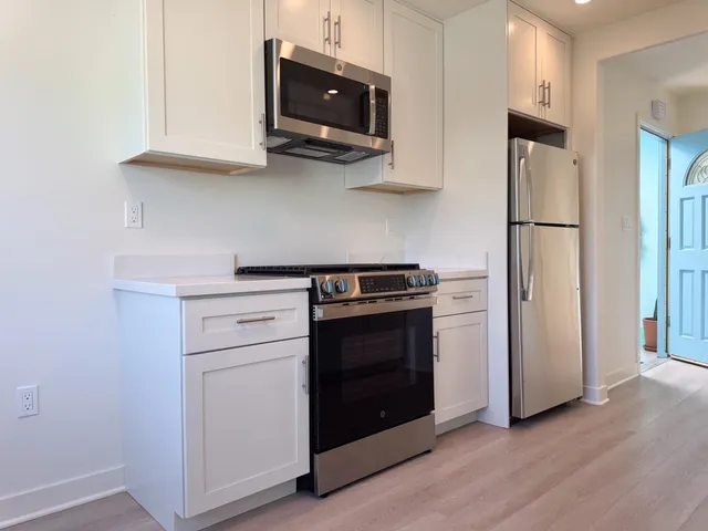 a living room with a couch and a flat screen tv