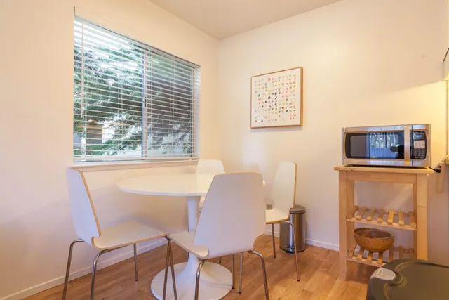 a kitchen with stainless steel appliances a stove a microwave and a refrigerator