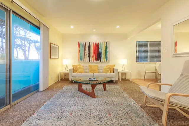 a bedroom with two beds and a window