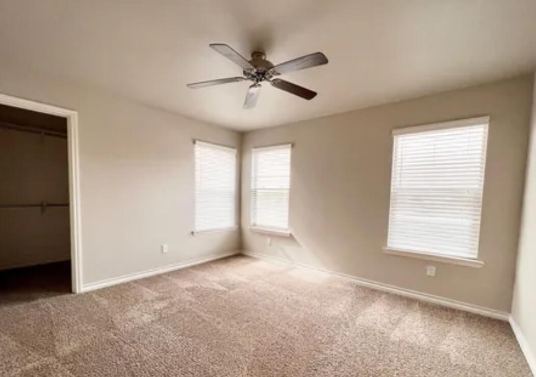 6040 24th Street, Unit 43 Lubbock, TX 79407 - Photo 7 of 11 a view of an empty room with a window
