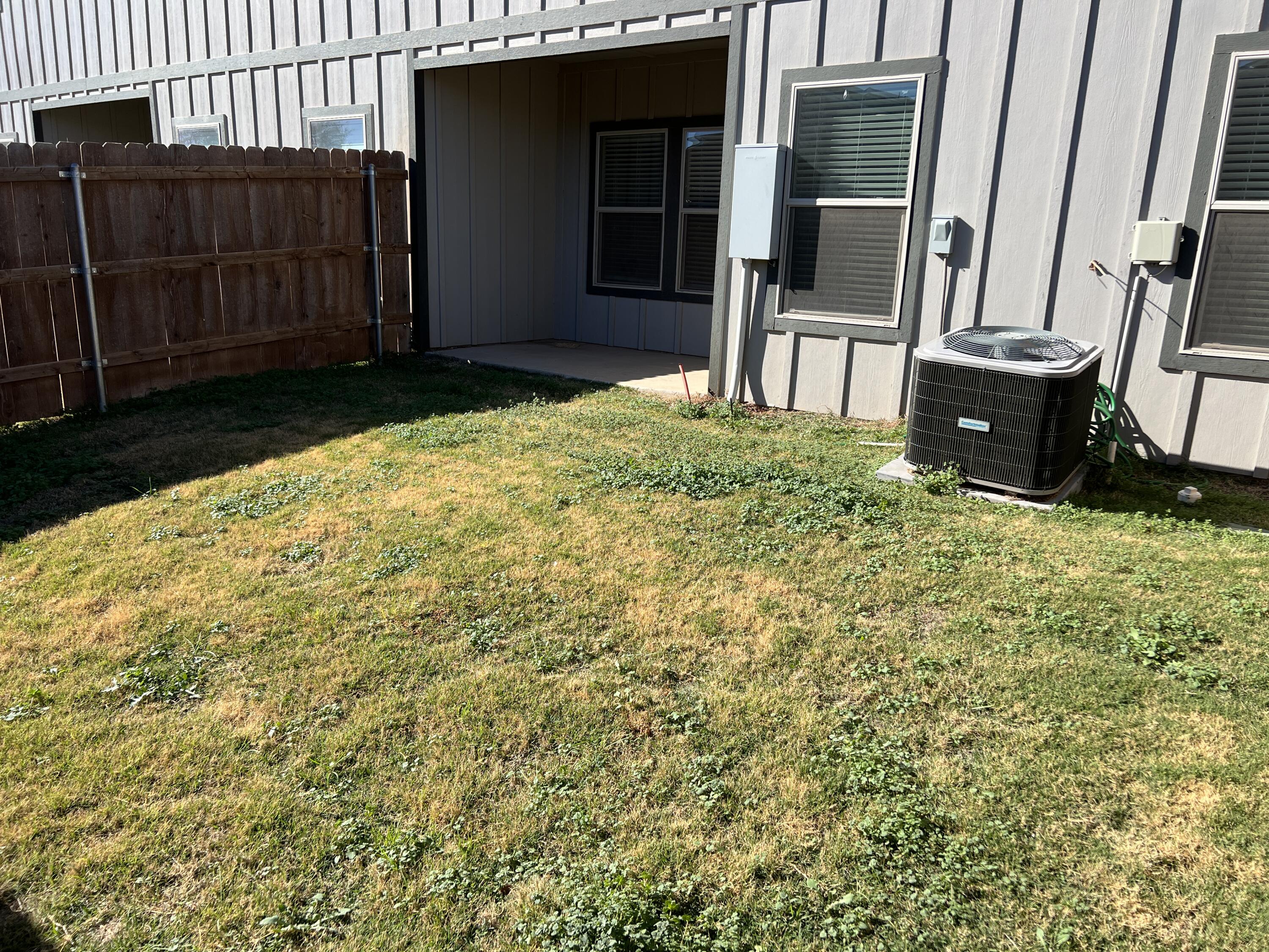 6040 24th Street, Unit 43 Lubbock, TX 79407 - Photo 9 of 11 a view of front door and yard