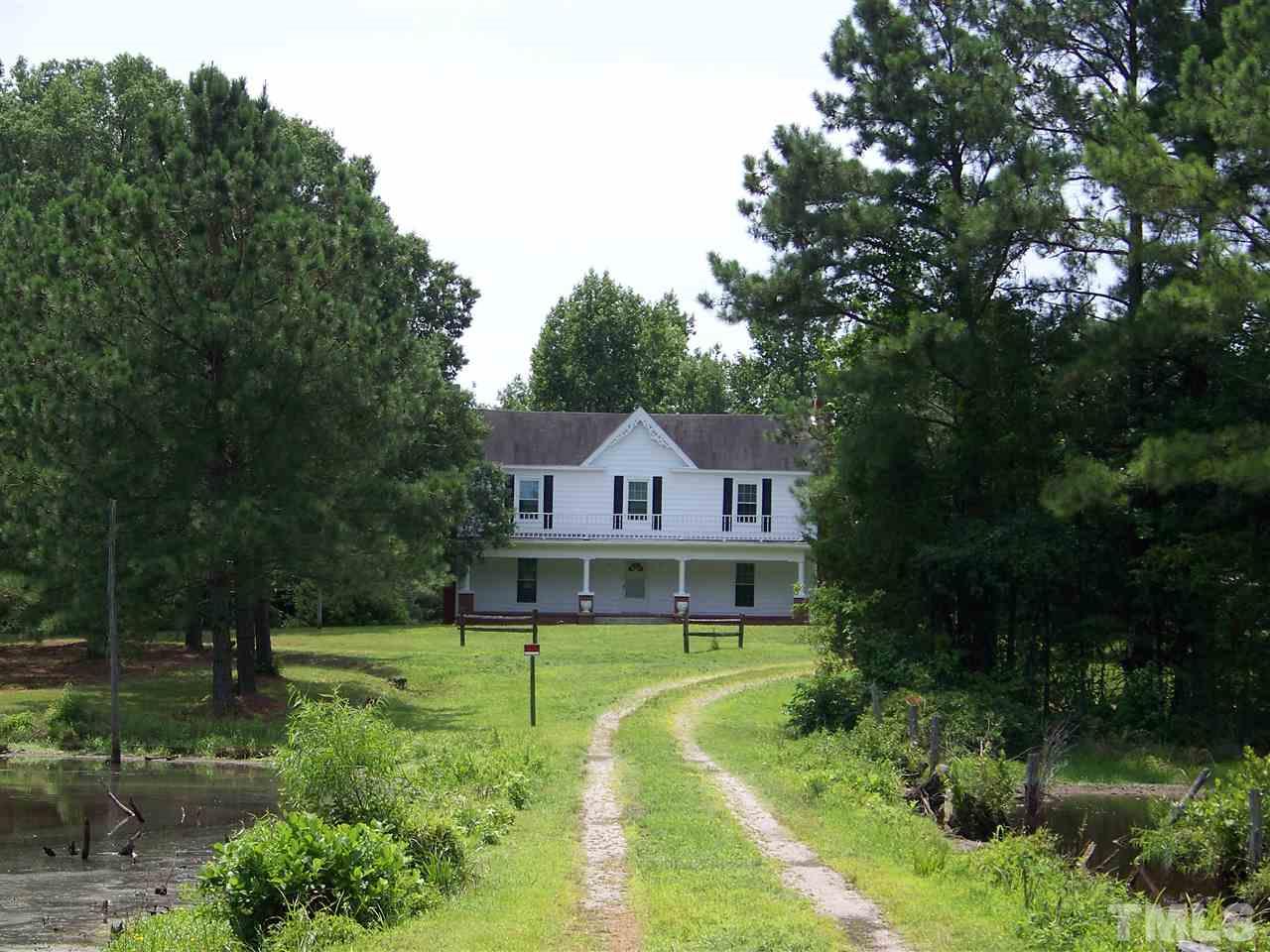 2114 Sanders Road Stem, NC 27581 - Photo 1 of 23 a front view of a house with a yard