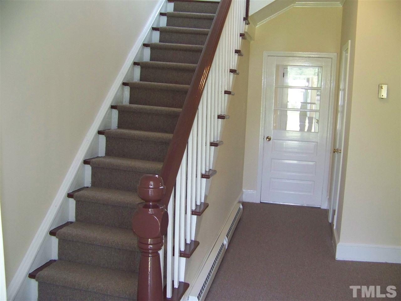 2114 Sanders Road Stem, NC 27581 - Photo 13 of 23 a view of staircase with white walls