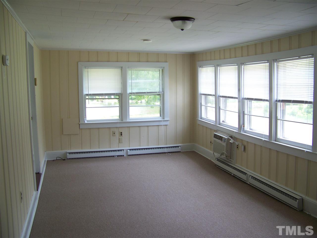 2114 Sanders Road Stem, NC 27581 - Photo 14 of 23 an empty room with a empty space and windows