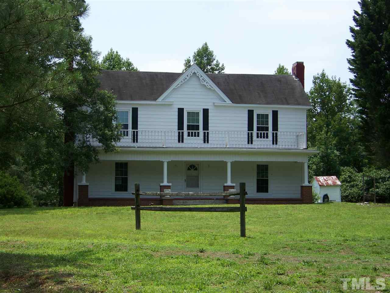 2114 Sanders Road Stem, NC 27581 - Photo 5 of 23 a front view of a house with a yard