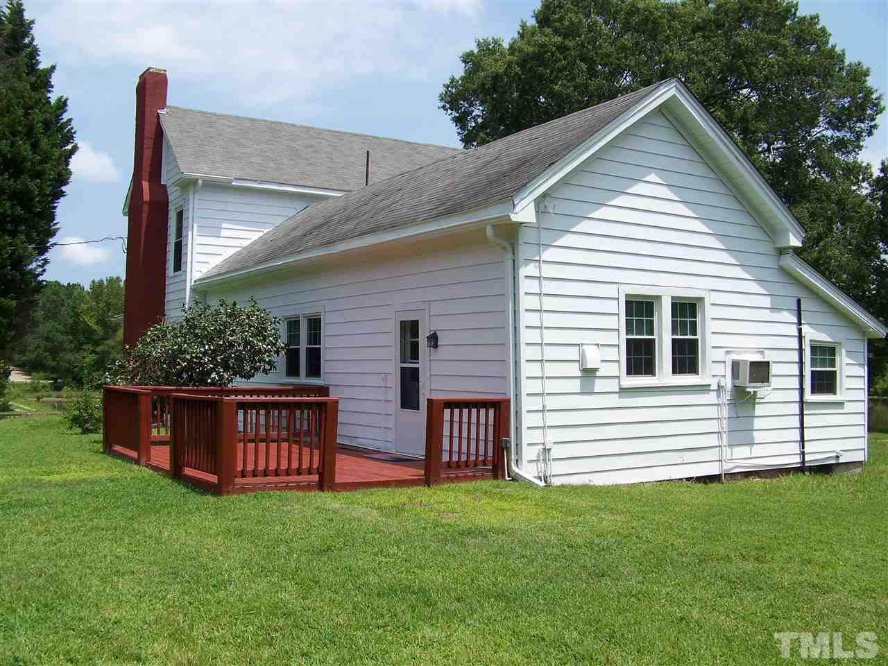 2114 Sanders Road Stem, NC 27581 - Photo 10 of 23 a front view of a house with garden